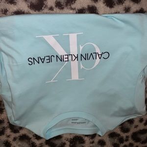 Calvin Klein jeans tee shirt, teal blue, medium, and never been worn